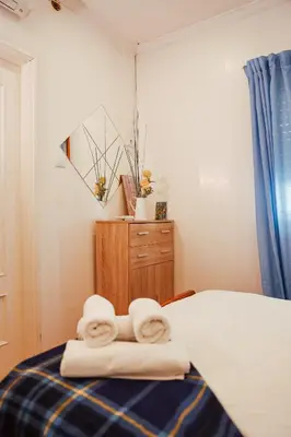 a bedroom with two towels sitting on a bed at Sailor's House - Holiday's House in Porto