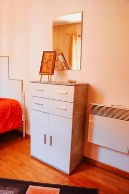 a bedroom with a white dresser and a mirror at Sailor's House - Holiday's House in Porto