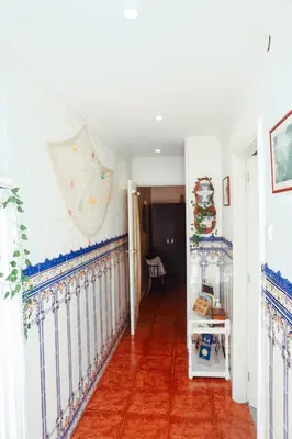 a hallway of a home with blue and white walls at Sailor's House - Holiday's House in Porto