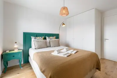 a bedroom with a bed with two towels on it at GuestReady - Splendid Retreat in Porto in Porto