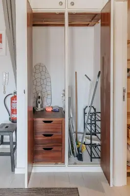 a room with a cabinet with sliding glass doors at Palácio de Cristal, Porto Apartment by Mycelia in Porto