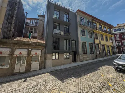 a row of buildings on a city street at Almada Comfy in Porto
