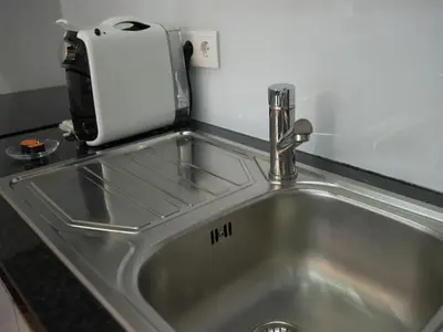 a kitchen sink with a toaster on top of it at Nidos Accommodation Gaia in Vila Nova de Gaia