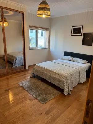 a bedroom with a bed and a large mirror at Hostel Antas Porto in Porto