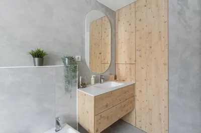 a bathroom with a sink and a mirror at GuestReady - Relaxing Getaway Near Porto in Vila Nova de Gaia