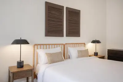 a bedroom with a white bed and two lamps at Casa Verde by Olala Homes in Porto
