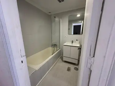 a white bathroom with a sink and a tub and a shower at Oporto Perfect Days - Downtown in Porto