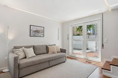 a living room with a couch and a window at GuestReady - Fantastic family home in Salgueiros in Porto