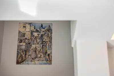 a painting hanging on a wall in a room at GuestReady - Fantastic family home in Salgueiros in Porto