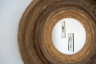 a close up of a roll of wood with two pictures in it at GuestReady - Lovely home with river view in Vila Nova de Gaia