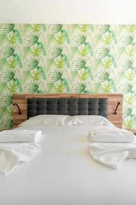 a bedroom with a bed with a floral wallpaper at Spacious 2BR en suite, downtown Porto in Porto