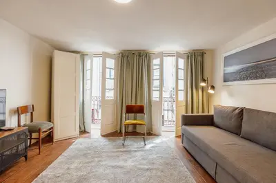 a dining room with a table with a bowl of fruit on it at Charming Apartment by Hosty in Porto