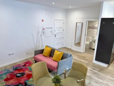 a living room with a couch and a table at Sounds of Porto 424 - Bolhão & Tradition in Porto