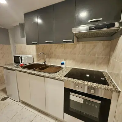 a kitchen with a sink and a stove at Monte Lapa 38 in Porto