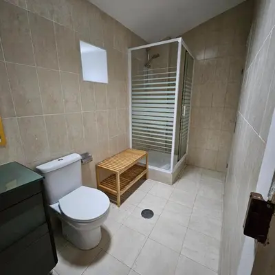 a bathroom with a toilet and a walk in shower at Monte Lapa 38 in Porto
