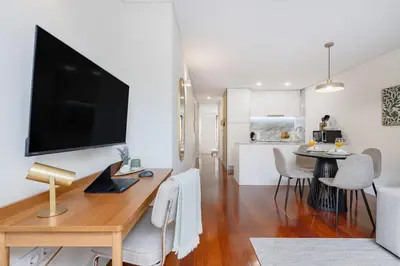 a bathroom with a washing machine and a sink at Patio Retreat | Porto Urban Flats in Porto