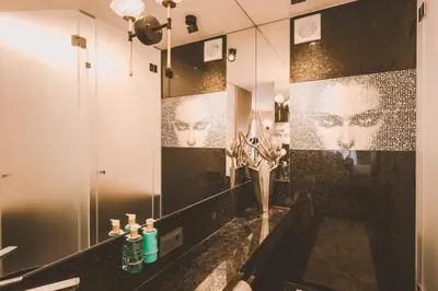 a bathroom with a sink and a mirror at Viterbo'8 - Bonjardim Apartments in Porto