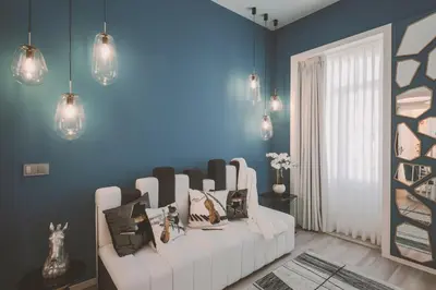 a living room with a white couch and blue walls at Viterbo'8 - Bonjardim Apartments in Porto