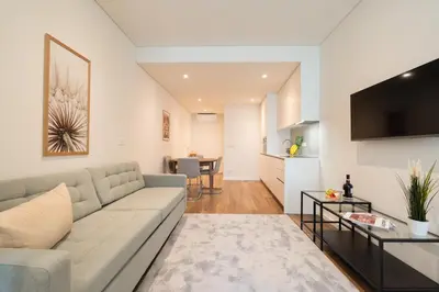 a kitchen and living room with a table and chairs at Host Wise - Marquesa Palace in Porto