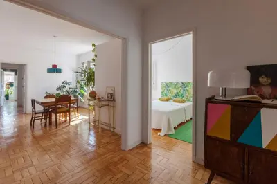 a living room with a table and a dining room at Aida's Haven - Bolhão in Porto