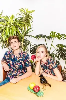 a man and a woman sitting at a table with fruit at Aida's Haven - Bolhão in Porto