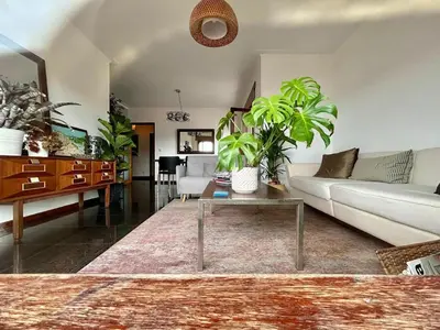 a living room with a couch and a table at Douro Exclusive View in Vila Nova de Gaia
