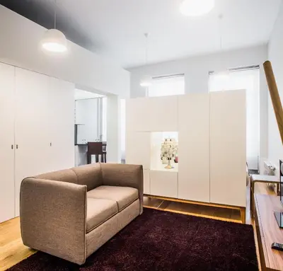 a living room with a couch and a table at Oportolazaro Premium Downtown Porto in Porto