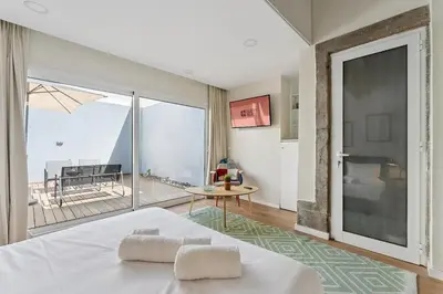 a bedroom with a bed and a view of the ocean at GuestReady - Relaxing Porto stay in Porto