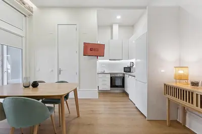 a kitchen and dining room with a table and chairs at GuestReady - Relaxing Porto stay in Porto