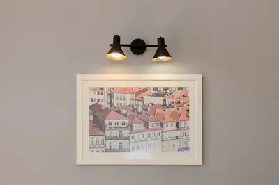 a balcony with two chairs and a table at Liiiving in Porto - Silver Light Apartment in Porto