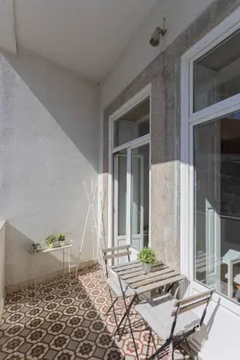 a white bathroom with a sink and a toilet at Liiiving in Porto - Silver Light Apartment in Porto