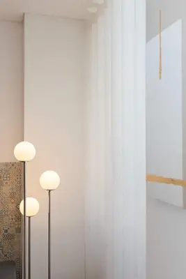a room with two white curtains and two lights at Liiiving in Porto - Invictus Bolhao Market in Porto