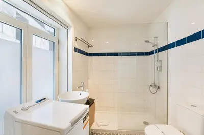a bathroom with a shower and a toilet and a sink at GuestReady - Douro Nest Apartments in Vila Nova de Gaia
