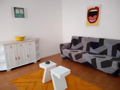 a dining room with a table and some chairs at Nice Belmonte Flat in Porto