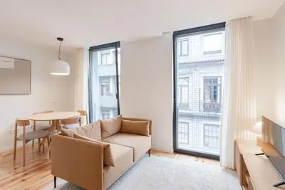 a living room with a couch and a table at VIVA Central Downtown Studio in Porto
