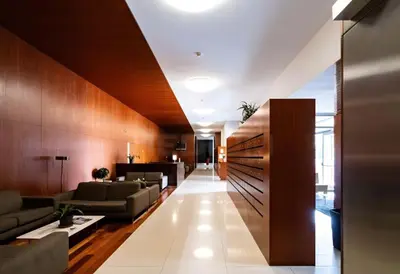 a lobby with couches and tables in a building at Oporto Blue Dragão - Modern Uptown Studio With Free Parking in Porto