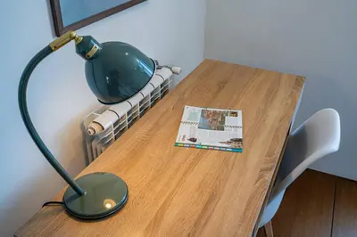 a kitchen with white cabinets and a sink at Carmo House - Art and Creativity in Downtown Porto in Porto