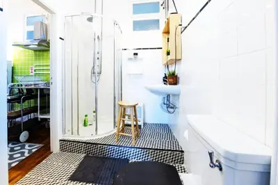 a bathroom with a shower and a toilet and a sink at Love&Life - Cosy&Central in Porto