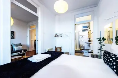 a bedroom with a large white bed in a room at Love&Life - Cosy&Central in Porto