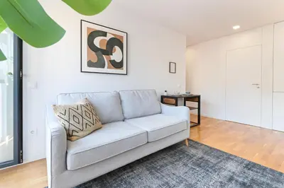 a room with white walls and a door with a bedroom at ON Apartments - Constituição 1386 in Porto