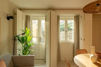 a dining room with a table and a window at Porto Haven - Under the Luís I Bridge in Porto