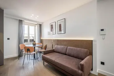 a living room with a couch and a table at Aspasios Baixa Apartments in Porto