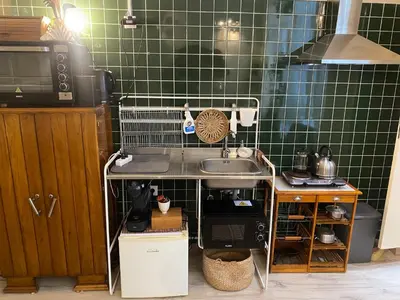 a small kitchen with a sink and a microwave at Family&Friends 1 - cosy&central in Porto