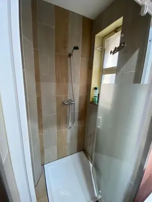 a bathroom with a shower with a glass door at Family&Friends 1 - cosy&central in Porto