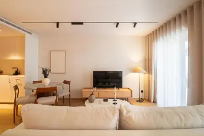 a living room with a couch and a table at Verde Almada 3d by LovelyStay in Porto