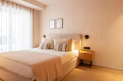 a bedroom with a white bed and a window at Verde Almada 3d by LovelyStay in Porto