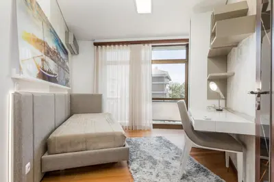 a bathroom with a tub and a sink and a bath tub at Apartamento de luxo Centro do Porto - ACE Residence in Porto