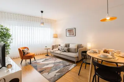 a living room with a couch and a table at Porto Stay no Marques with AC and parking place in Porto