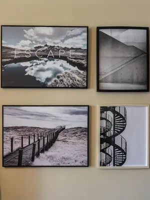a group of four pictures hanging on a wall at Apartamento T3 perto do Centro do Porto, Check-in 24 horas,Cozinha totalmente equipada, Wi-Fi 44Mbps, Propriedade Confortável e Espaçosa, Com Vaga de Carro Pública, Adequada para famílias, hóspedes em negócios e grupos de amigos e nomades digitais in Porto