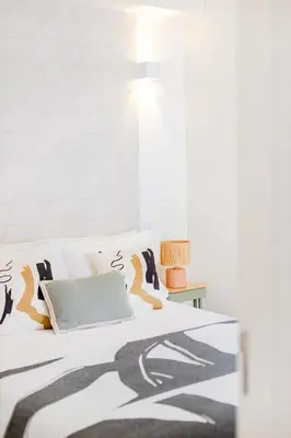 a bathroom with a washing machine and a window at Clérigos Loft | 111 Collection in Porto